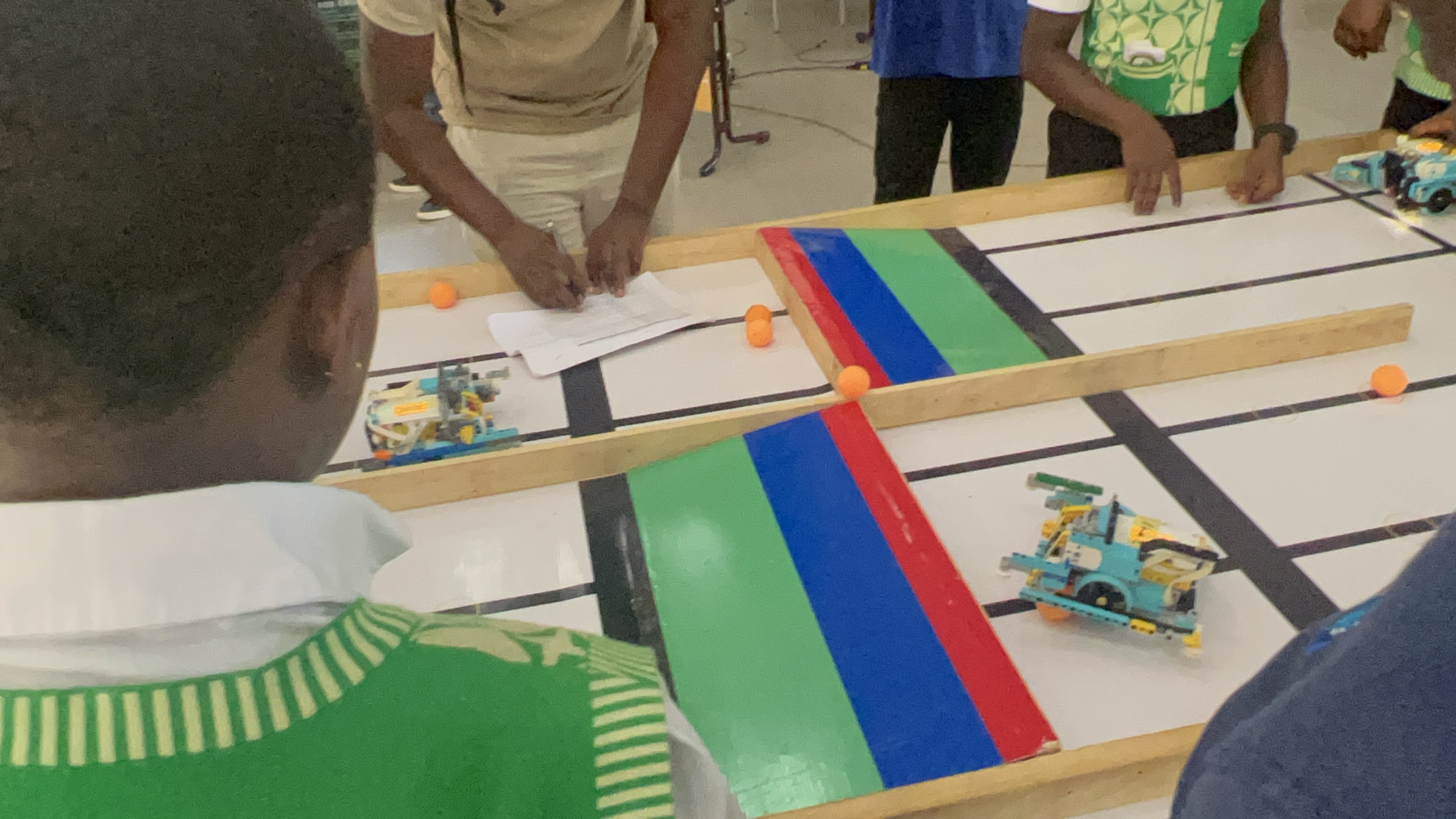 Students testing robots on a competition track